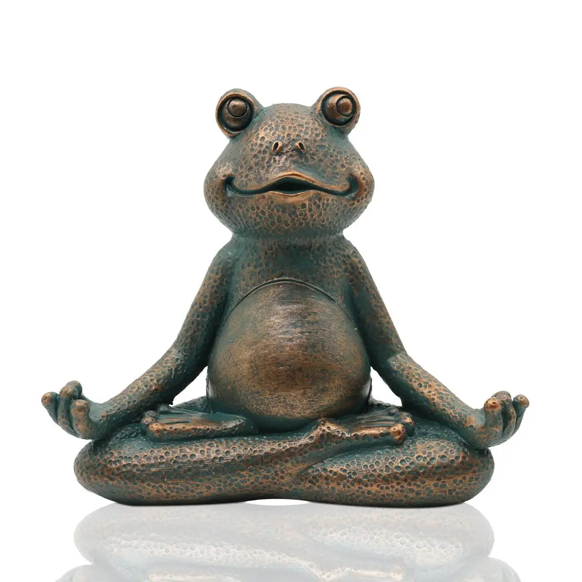 A bronze frog statue sits in a meditative lotus position with a serene smile, textured surface, and outstretched hands resting on knees against a reflective background.