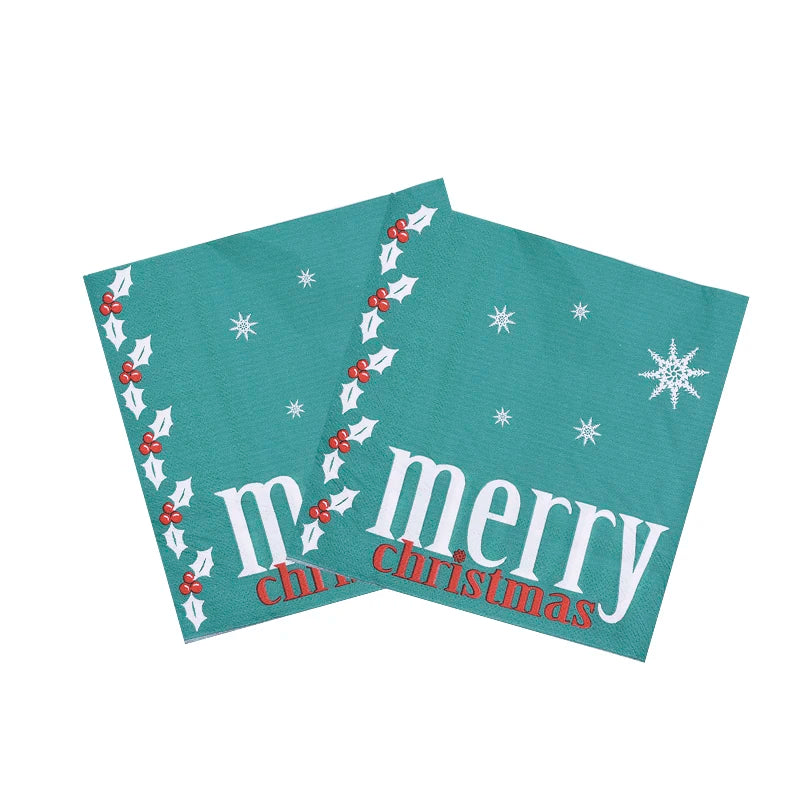 Festive teal napkins with white snowflakes and holly design, featuring the words "Merry Christmas" in white and red.