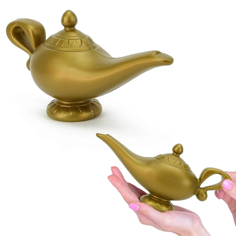 Golden-colored magic lamp with ornate details, featuring a spout and handle. It rests on a small base; two images show the lamp alone and held in hands with pink nail polish.