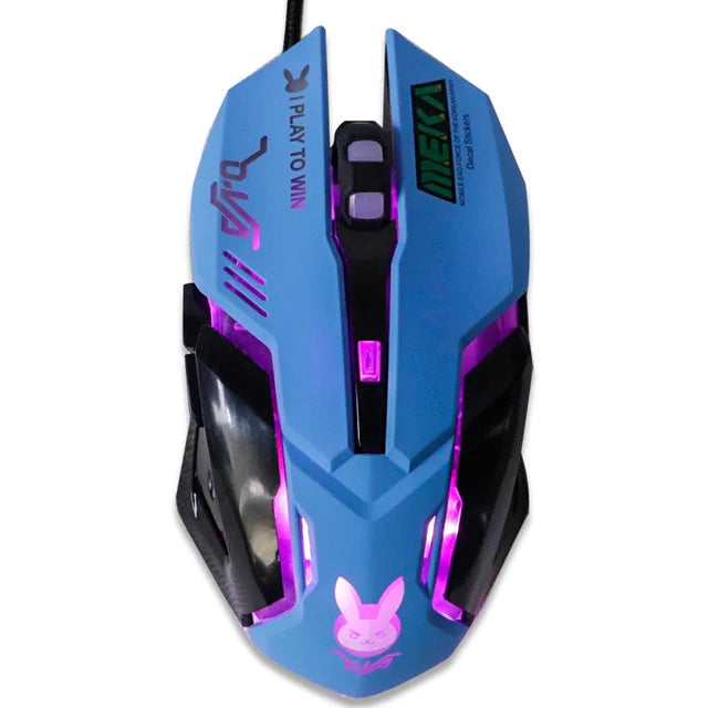 Gaming mouse in blue and black with pink LED lighting, featuring a bunny logo and the phrase "I Play to Win." The design is angular with extra buttons on top.