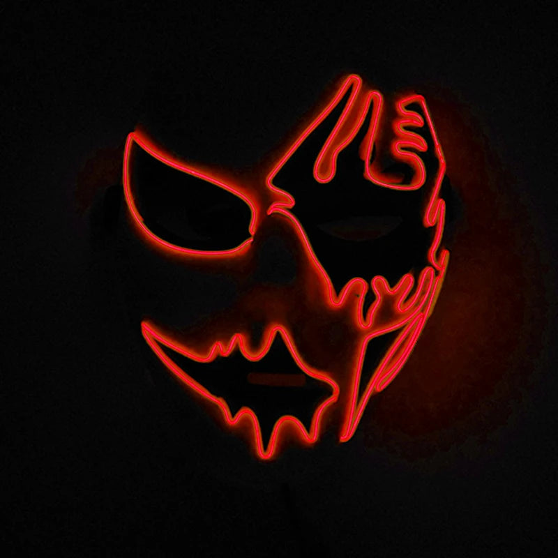 A dark background features a glowing neon mask with jagged, sinister red outlines, resembling a stylized face with sharp eyes and mouth, creating an eerie and dramatic effect.