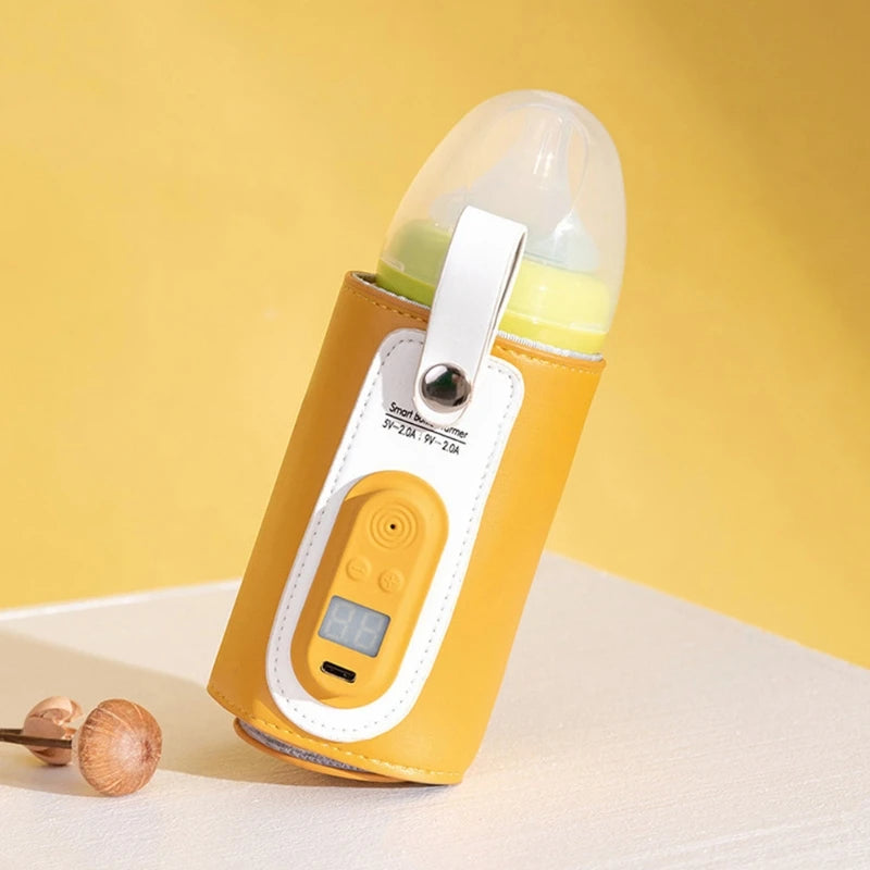 Smart baby bottle warmer in a yellow and white design, featuring a digital display and USB port. It stands on a white surface against a yellow background, next to wooden mushrooms.