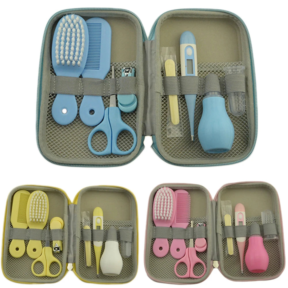 Three baby grooming kits in blue, yellow, and pink. Each kit includes a brush, comb, scissors, nail clippers, thermometer, dropper, and nasal aspirator in a zip pouch.