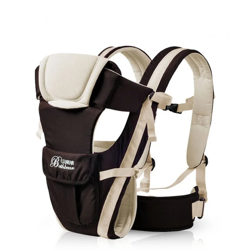Black and beige baby carrier with adjustable padded straps and ergonomic support. Features front pocket with logo detailing, suitable for hands-free baby carrying.