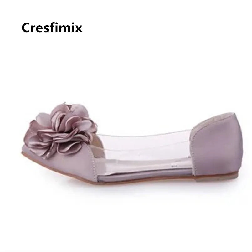 Purple flat shoe with a large flower embellishment on the toe and transparent sides. Brand name "Cresfimix" is displayed above the shoe on a white background.