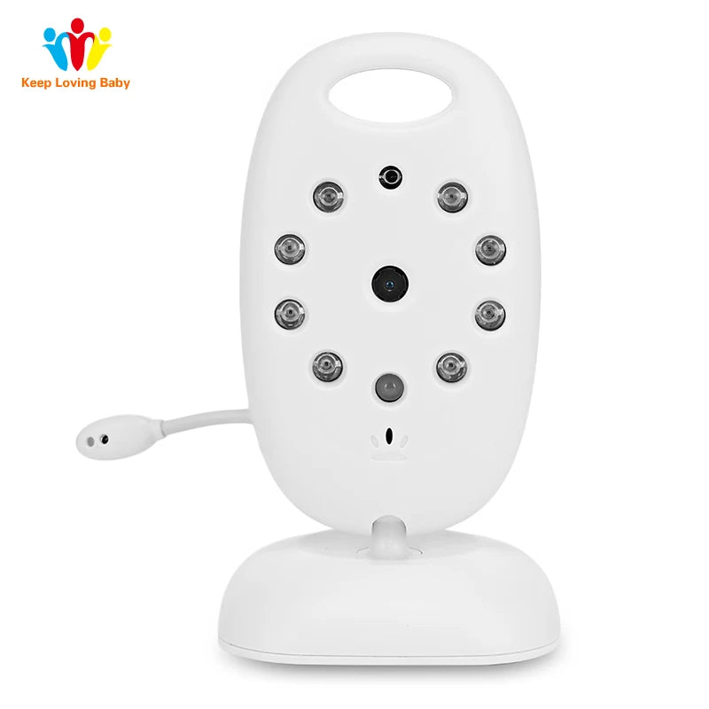 White baby monitor with multiple sensors and a central camera on a stand. It has a rounded handle and a small microphone extending from the side.