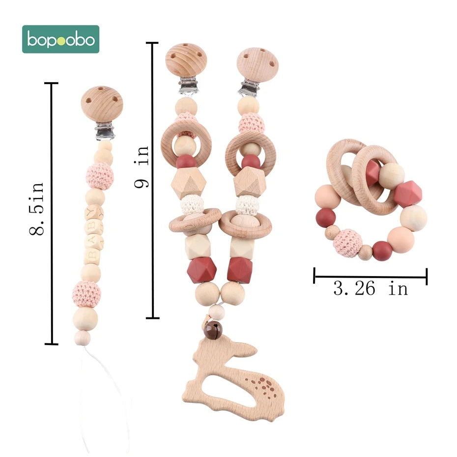 Set of baby teething pacifier clips and rattle, featuring wooden beads and crochet details. Clip sizes are 8.5 and 9 inches long; rattle diameter is 3.26 inches.