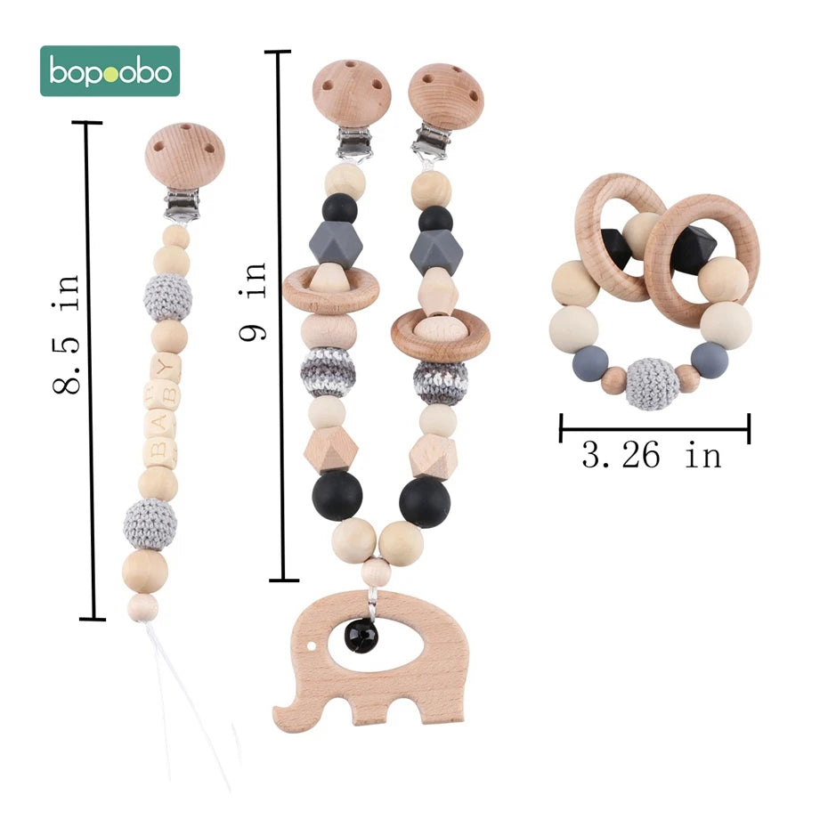 Wooden and crochet teething toys set, including an 8.5-inch pacifier clip, 9-inch teething chain with elephant pendant, and a 3.26-inch bead ring, ideal for babies.