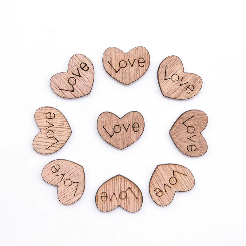 Nine wooden heart-shaped pieces arranged in a circle, each engraved with the word "Love" in different orientations, on a white background.