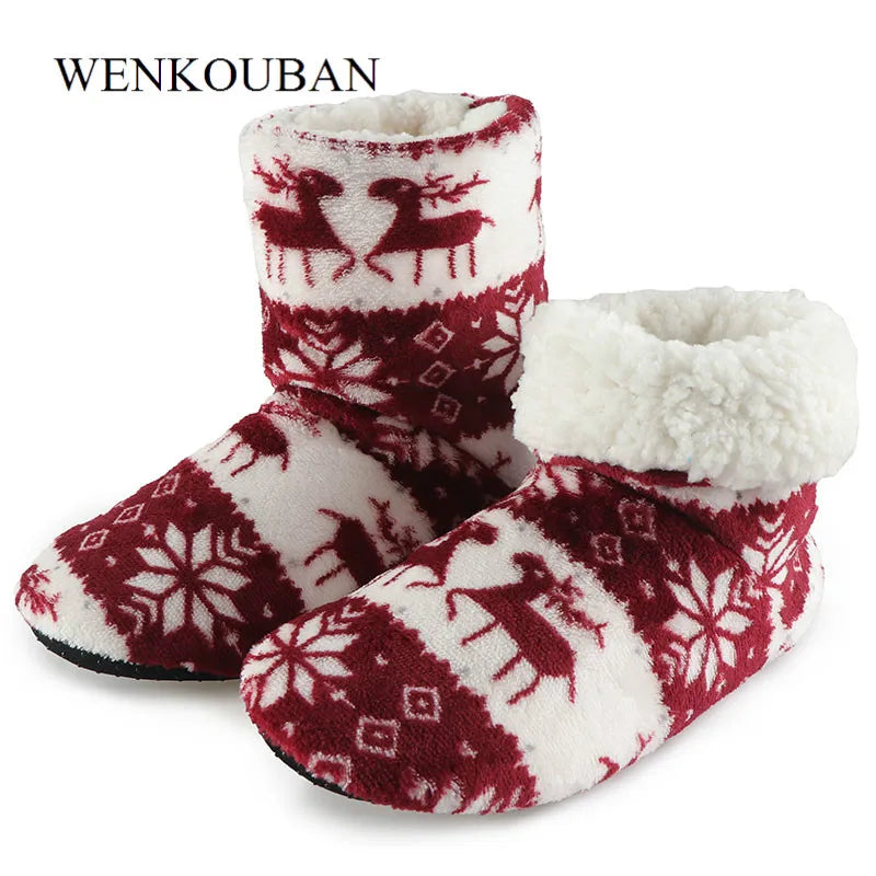 Cozy red and white winter slippers with reindeer and snowflake patterns, featuring soft white fleece interiors for warmth and comfort.
