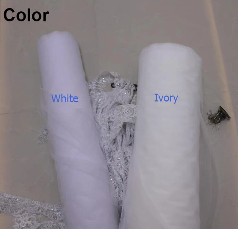 Two rolls of fabric labeled "White" and "Ivory" are surrounded by lace and bead embellishments on a light background.