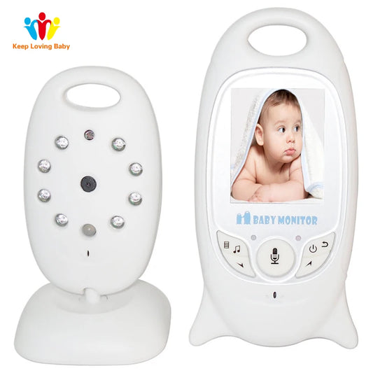 A dual baby monitor system with a camera unit on the left, featuring night vision lights, and a parent unit on the right displaying a photo of a baby wrapped in a towel.
