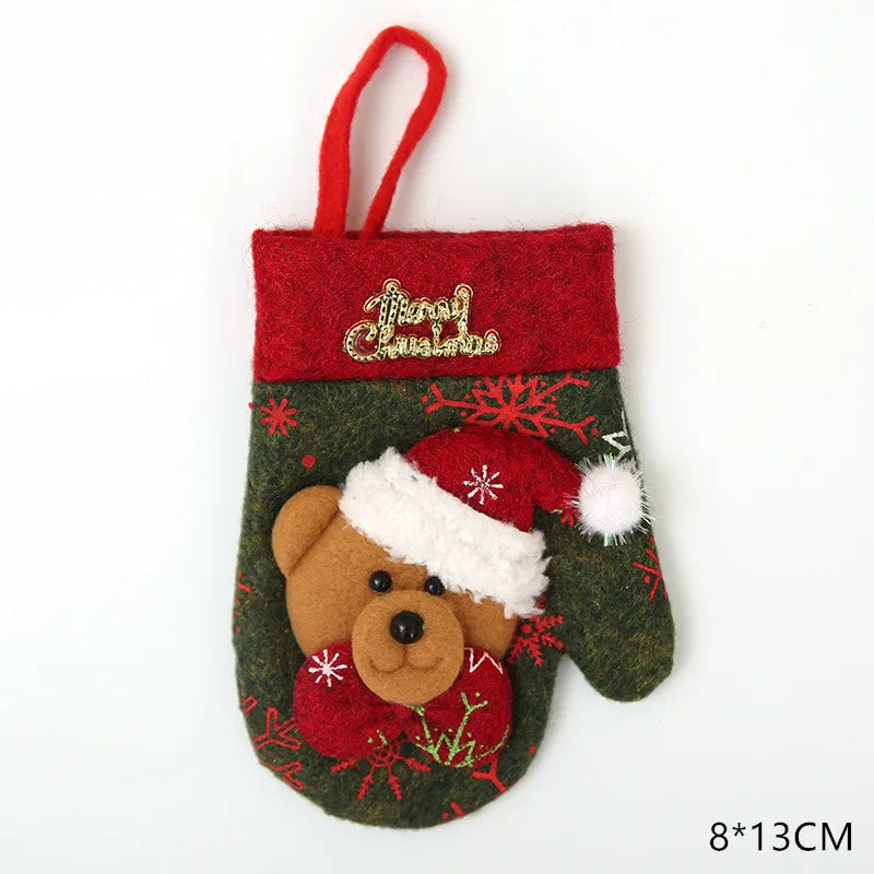 Festive green and red felt stocking with "Merry Christmas" embroidery, featuring a teddy bear in a Santa hat design. The stocking measures 8x13 cm and has a hanging loop.