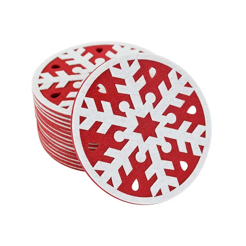 A stack of round red and white coasters with intricate snowflake cutouts. The design features a bold red base and white snowflake pattern, perfect for a festive tabletop setting.