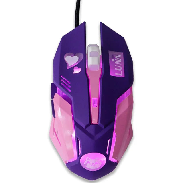 Purple gaming mouse with pink LED lights, heart designs, and "LUNA" text. It features side buttons and a scroll wheel, with a USB cord attached.