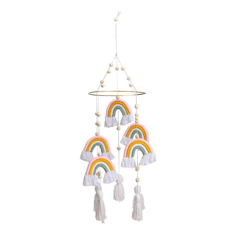 Hanging mobile with colorful rainbow designs and white tassels, crafted from yarn and wooden beads on strings.