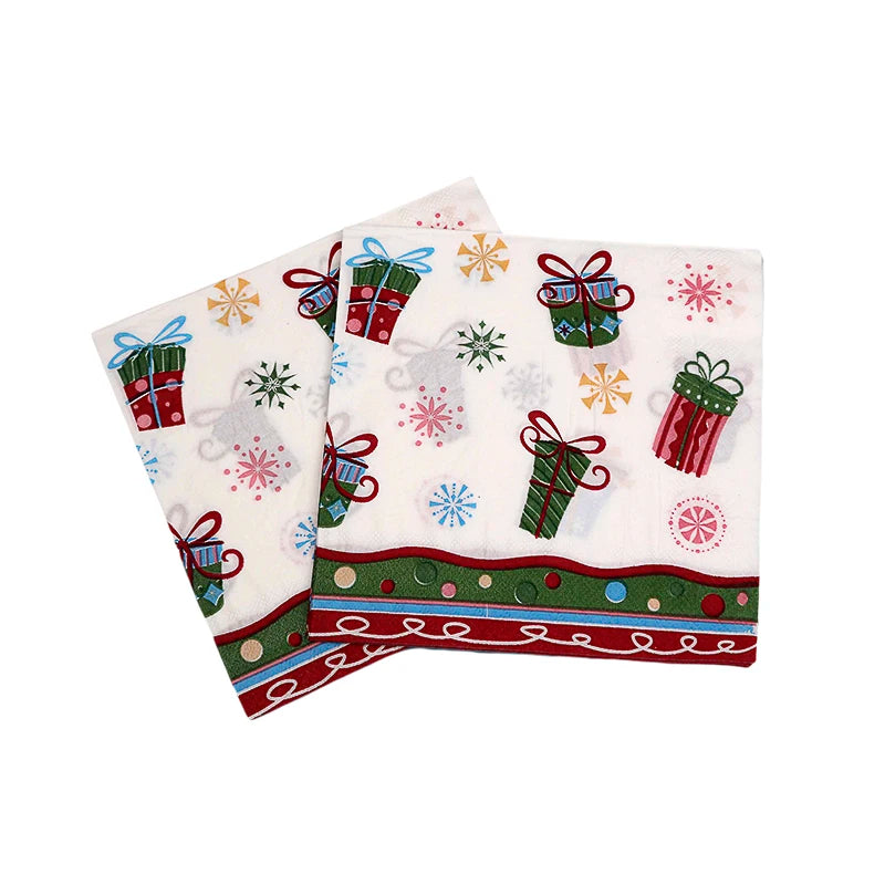 Festive napkins with colorful gift boxes, snowflakes, and a decorative border in red and green. The design features blue, red, and gold accents on a white background.