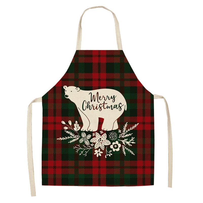 Christmas apron with red and green plaid pattern, featuring a white bear silhouette with "Merry Christmas" text and floral decorations at the bottom.