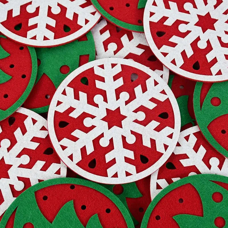 Circular holiday coasters with white snowflake cutouts on red and green backgrounds, overlapping in a festive arrangement.