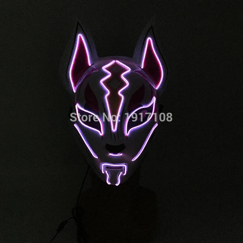 A glowing mask with fox-like features, illuminated by purple and pink LED lights in a dark setting. The mask includes dramatic patterns and pointed ears.