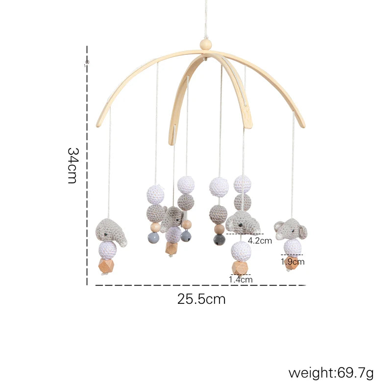 Wooden baby mobile with crochet animals and beads, measuring 34cm high and 25.5cm wide. Features soft elephants and koalas, weighing 69.7g.