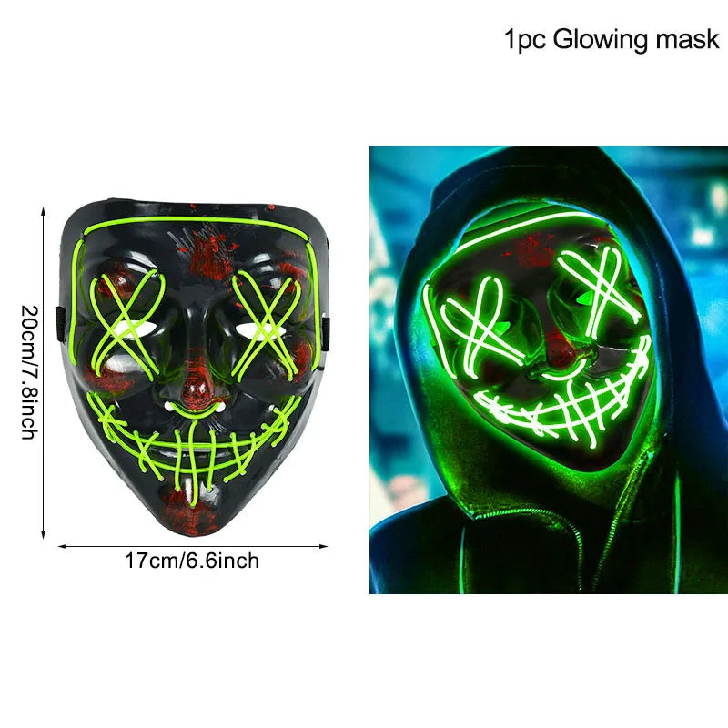 Glowing LED mask with green neon outlines in a smile and X eyes design. Shown worn with a hood, creating an eerie effect. Dimensions: 20cm x 17cm.