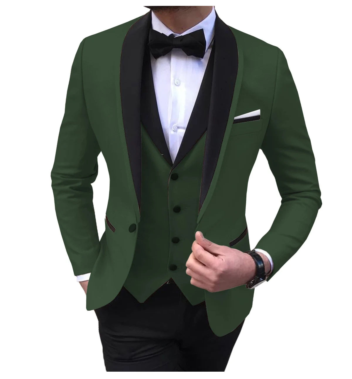 Man wearing a green tuxedo with black lapels, white shirt, and black bow tie. He is adjusting the left side of the jacket with his right hand.