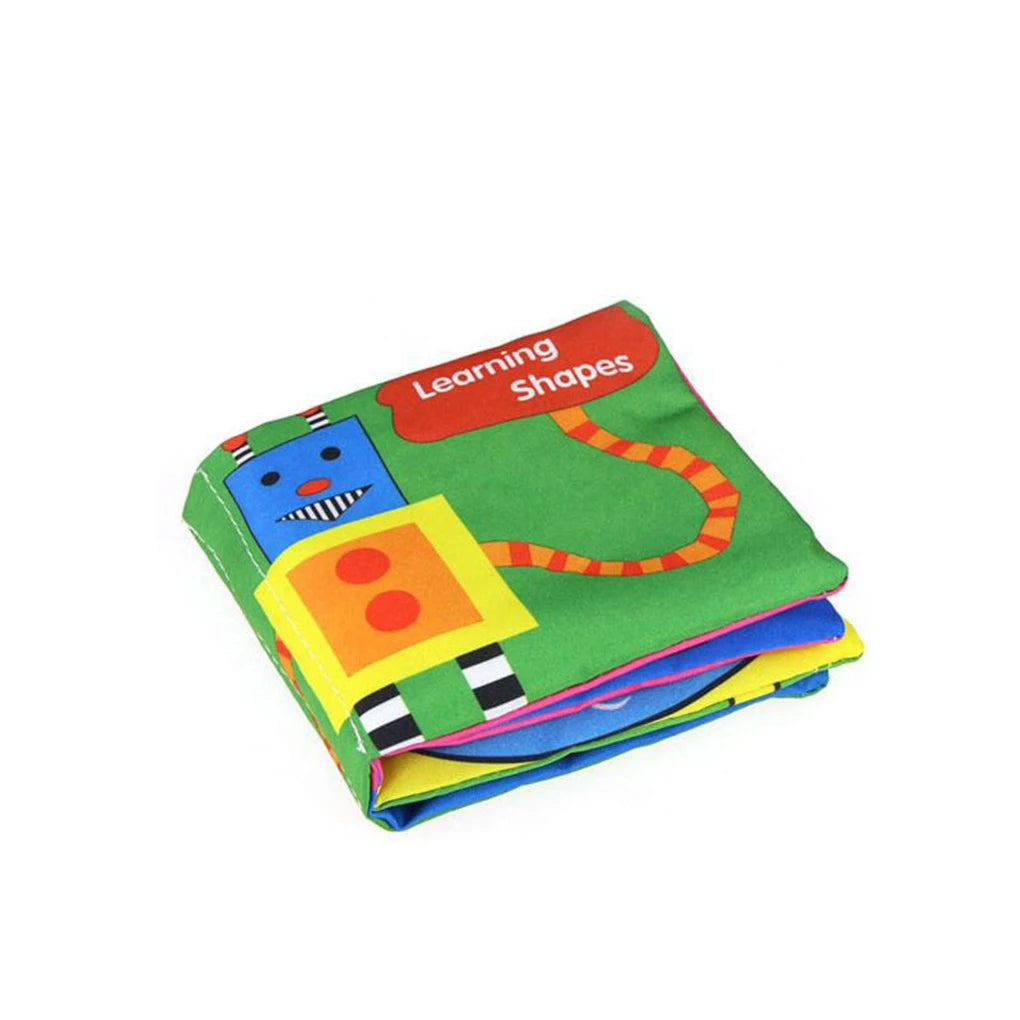 Colorful cloth book titled "Learning Shapes" with a robot design on the cover, featuring bright green, blue, and yellow pages.