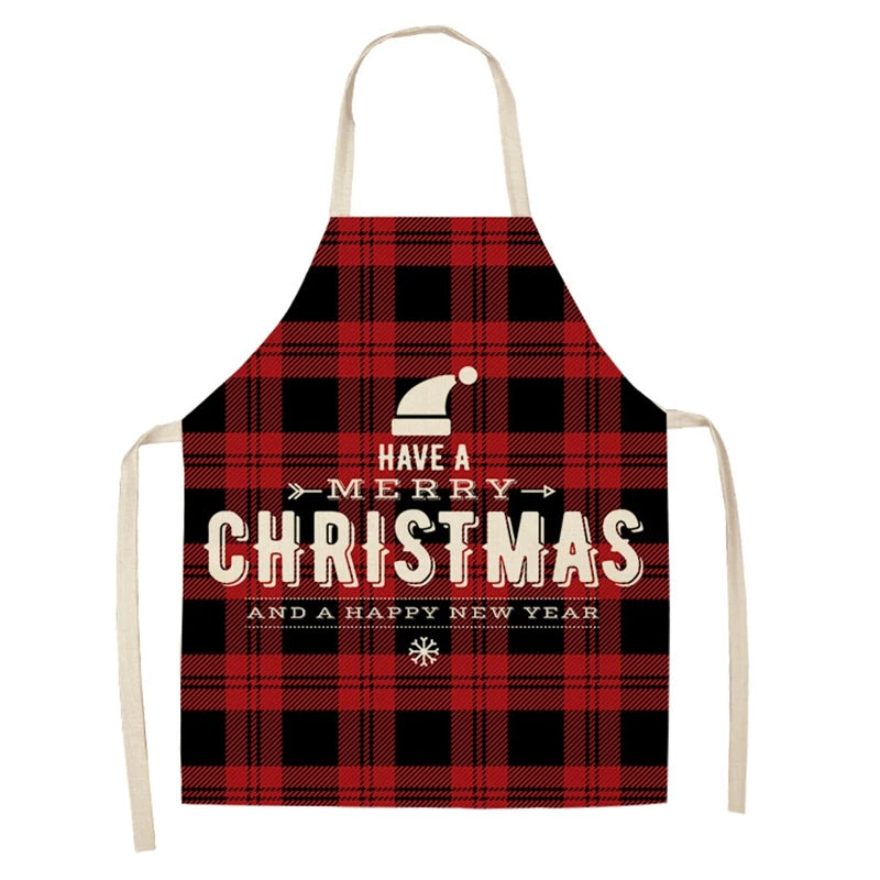 Red and black checkered apron with the text "Have a Merry Christmas and a Happy New Year" in white, featuring a Santa hat illustration and decorative snowflake.