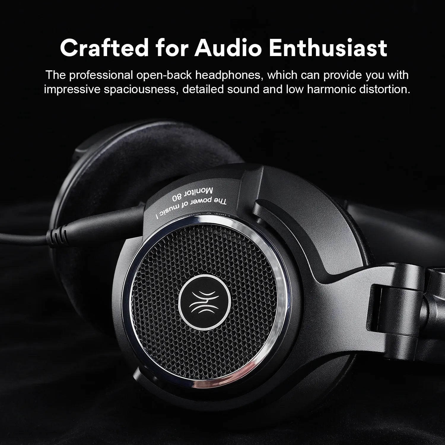 Close-up of sleek black open-back headphones with a silver trim and mesh design. Text above reads "Crafted for Audio Enthusiasts" describing detailed sound and low distortion.