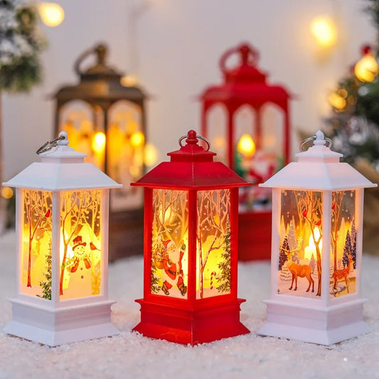 Festive lanterns in white and red, glowing with warm light. Each lantern features Christmas scenes with snowmen, Santa, and reindeer, set on a snowy surface with soft-focus lights behind.