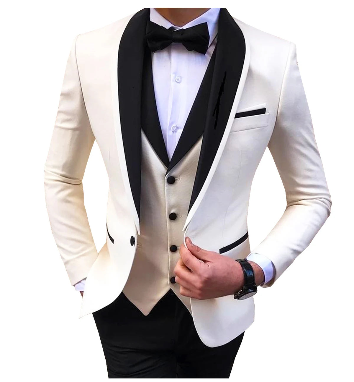 A person wearing an elegant white tuxedo with black lapels, a matching vest, and a black bow tie. The outfit is complemented by a watch on the left wrist.