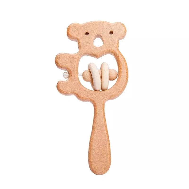 Wooden bear-shaped baby rattle with a handle and two small rings inside the bear's body.