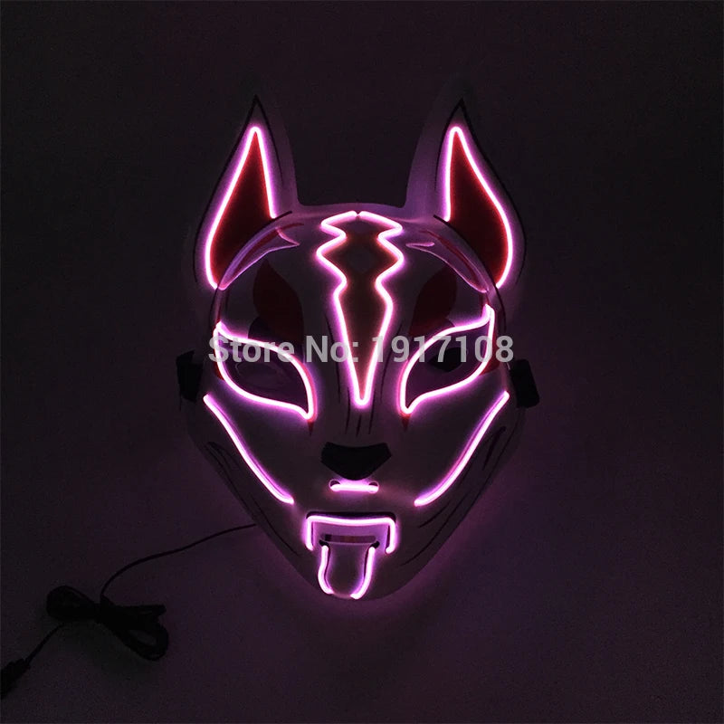 LED fox mask glowing in pink and white with ear and facial patterns illuminated against a dark background. A wire is attached to the mask.