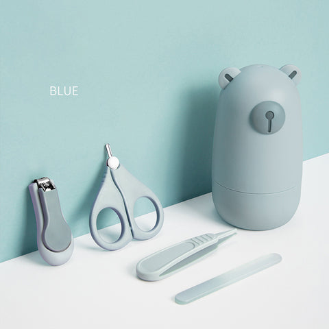 Blue manicure set with a cute bear-shaped case. Includes nail clippers, scissors, tweezers, and a file. Items are neatly arranged against a matching blue background.