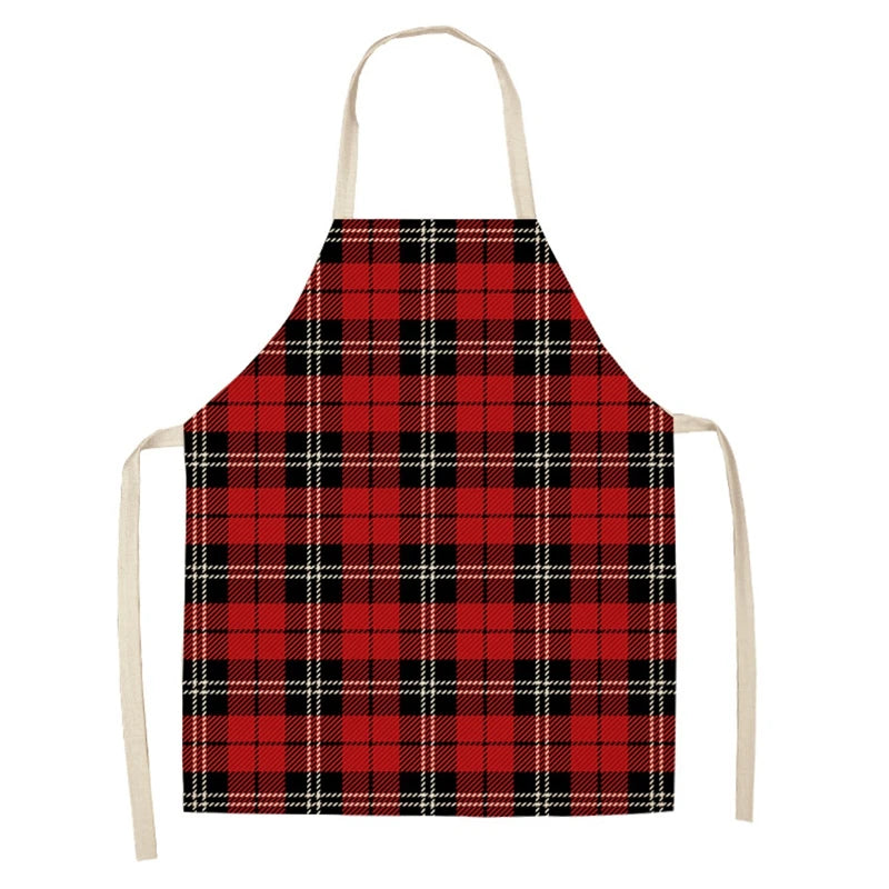 Red and black plaid apron with a classic tartan pattern, featuring beige neck and side ties, displayed against a plain white background.