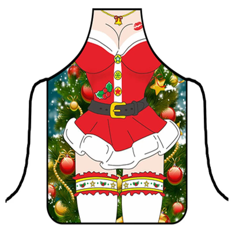 Festive apron featuring a cartoon Christmas outfit with a red dress, white trim, black belt, and holly. Background shows a decorated Christmas tree with ornaments and stars.