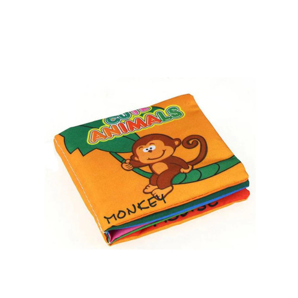 Orange children's fabric book titled "Cute Animals" with a cartoon monkey swinging on a tree. Pages are folded, showing colorful edges.