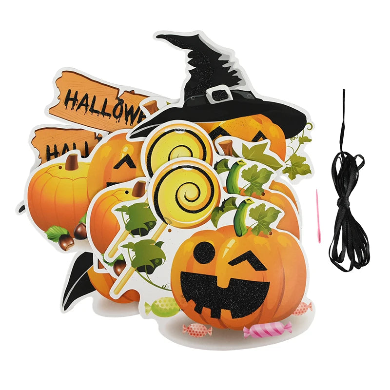Colorful Halloween-themed cutouts featuring jack-o'-lanterns, some wearing witch hats, along with wooden signs, yellow lollipops, and scattered candies. Green leaves add detail. A black string is included, possibly for hanging decorations. The overall vibe is festive and playful.