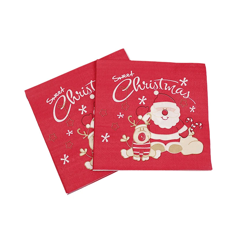 Red napkins with a festive Santa and reindeer design, featuring the phrase "Sweet Christmas" in white lettering, adorned with stars and candy cane visuals.