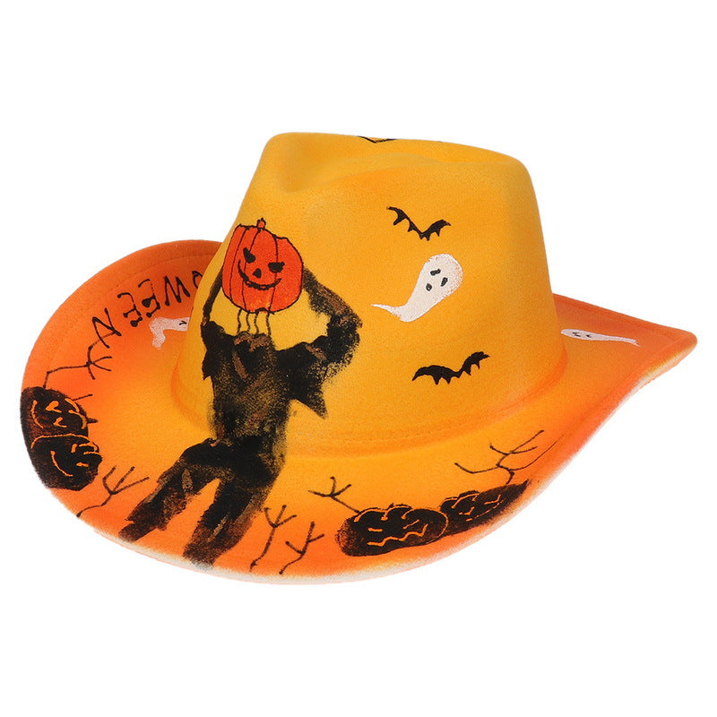Orange cowboy hat with Halloween designs, including ghosts, bats, pumpkins, branches, and a figure holding a jack-o'-lantern head. The brim has "Halloween" in red.