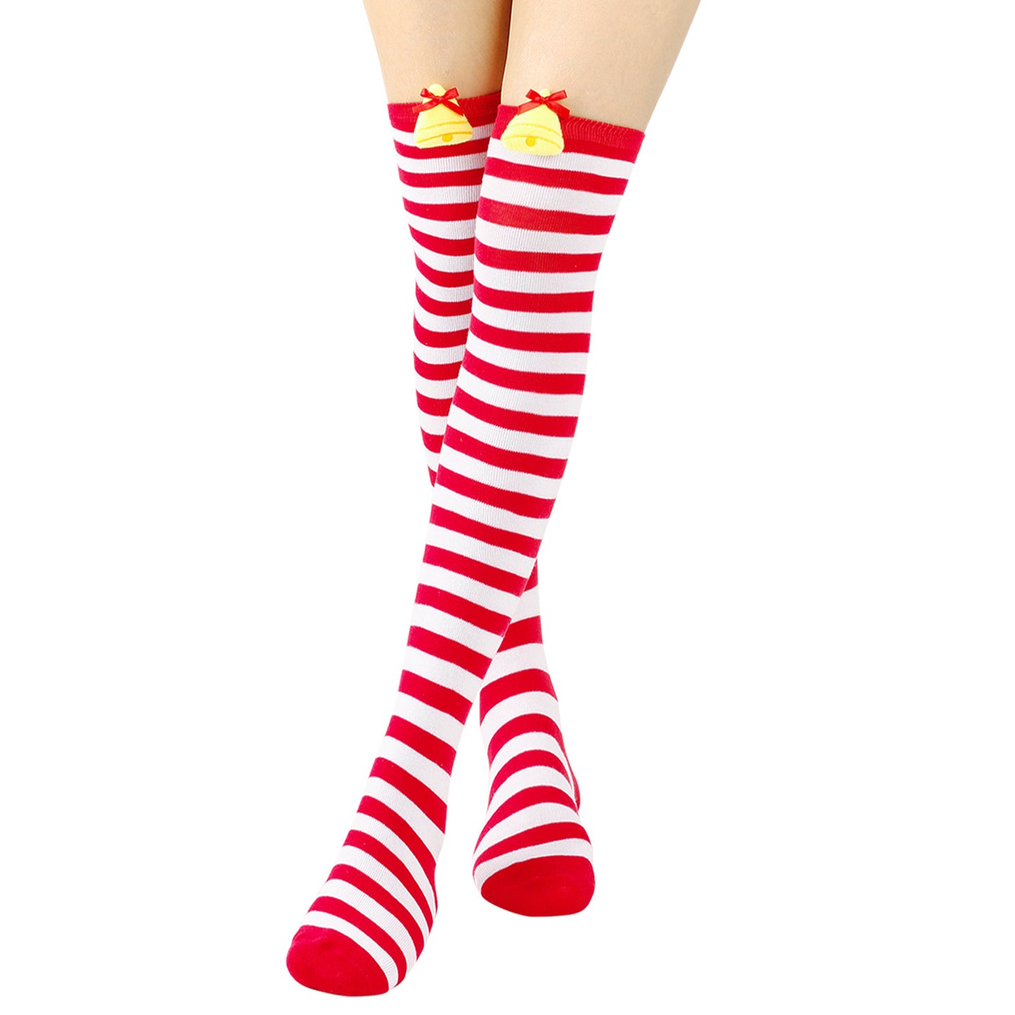 Red and white striped knee-high socks with yellow bell and red bow accents at the top, worn on crossed legs, against a white background.