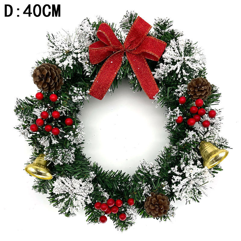 Festive wreath with snow-dusted greenery, red berries, pine cones, and golden bells, adorned with a large red bow. Diameter noted as 40cm in the image corner.