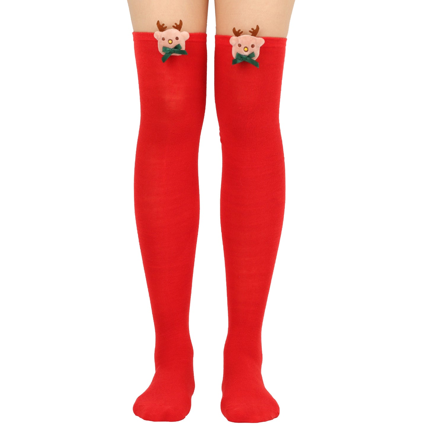 Red knee-high socks featuring cute reindeer faces with antlers and green bows near the top edges, worn by a person from mid-thigh down to feet.