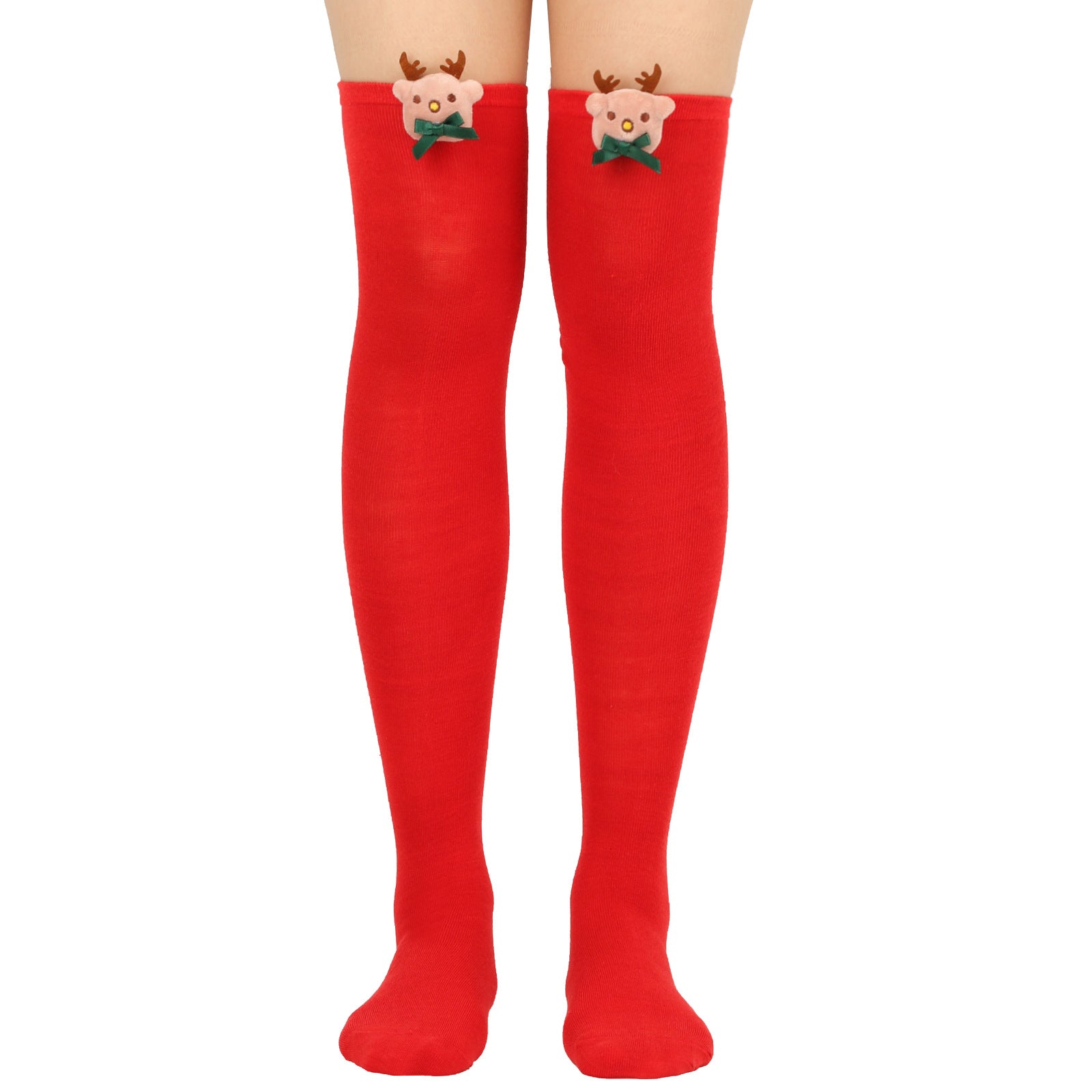 Red knee-high socks featuring cute reindeer faces with antlers and green bows near the top edges, worn by a person from mid-thigh down to feet.