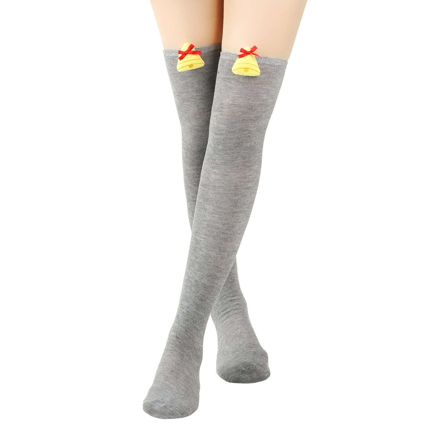 Gray thigh-high socks with yellow bell and red bow ornaments near the top, worn on crossed legs against a white background.