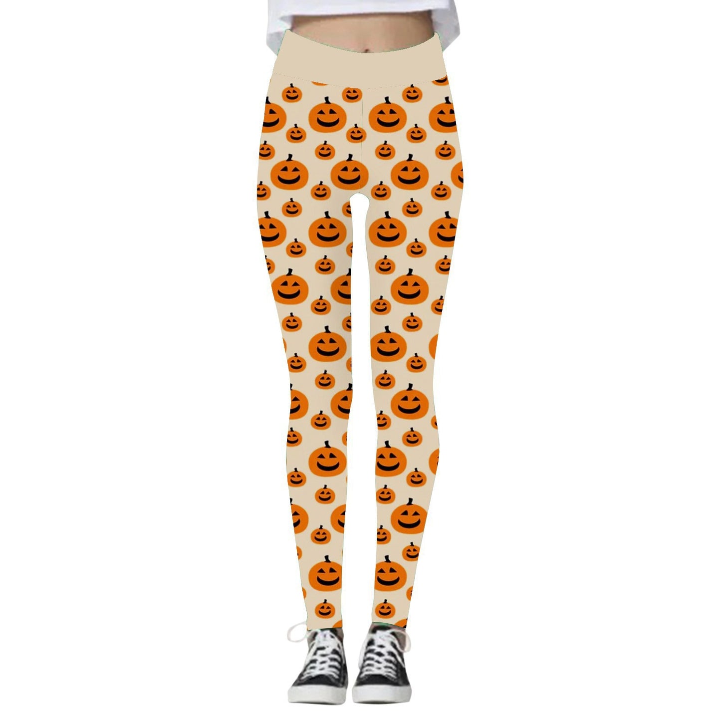 Leggings with a playful orange jack-o'-lantern pattern on a light background, paired with black and white sneakers. Perfect for a festive Halloween look.