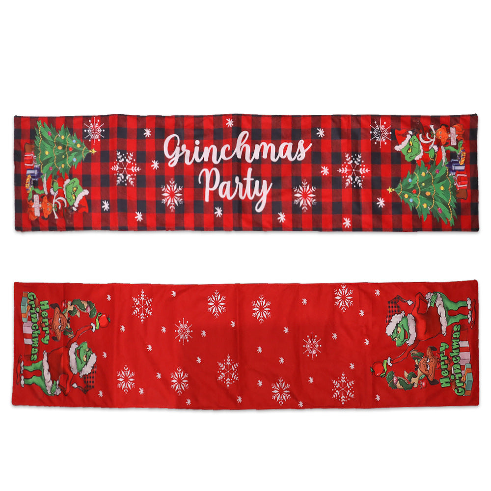 Red and black checkered banner with "Grinchmas Party" text, featuring green characters by a Christmas tree. Another red banner shows characters with "Merry Grinchmas" and snowflakes.