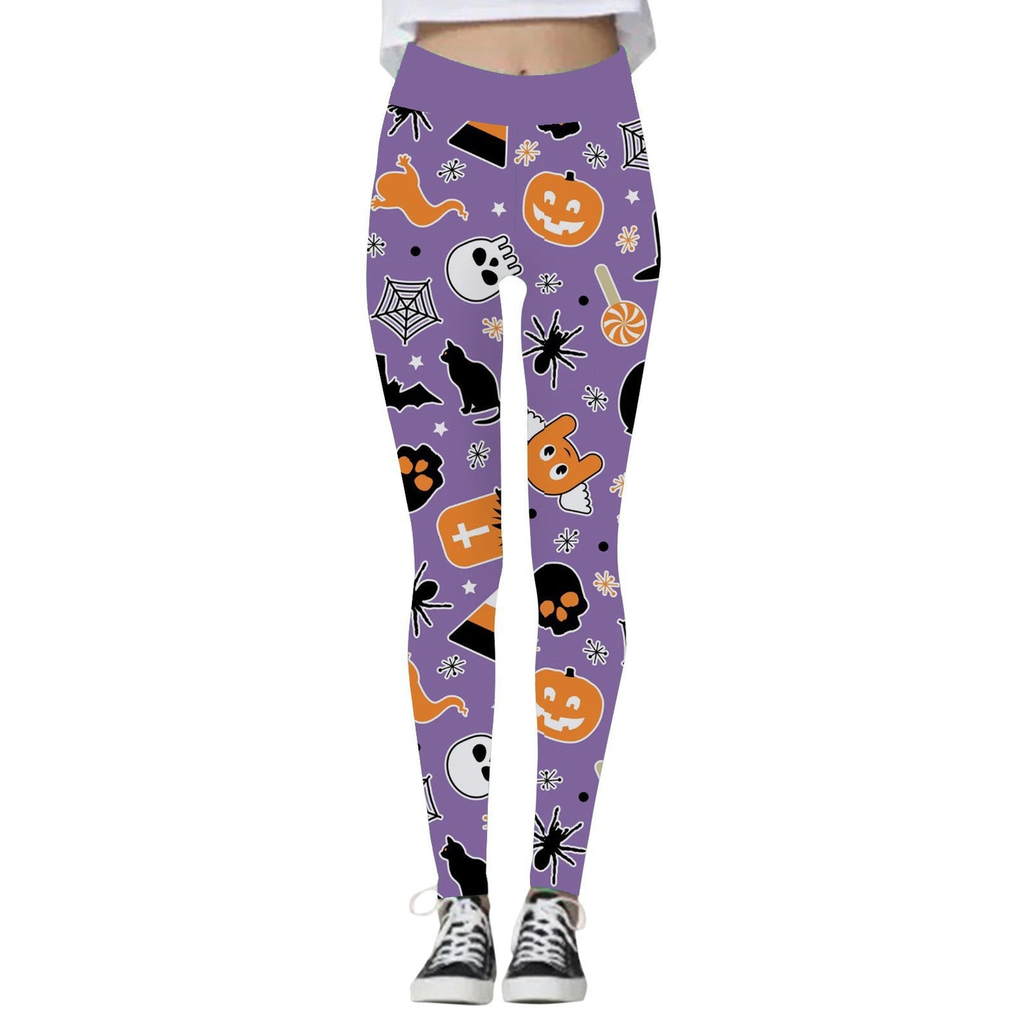Purple Halloween-themed leggings featuring pumpkins, skulls, bats, spiders, candy, and other festive icons, paired with black and white sneakers.