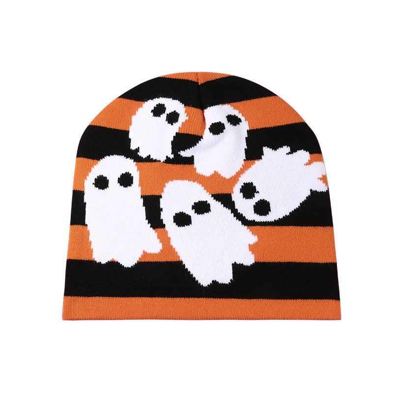 An orange and black striped beanie featuring white ghost illustrations with black eyes, creating a playful Halloween-themed design.